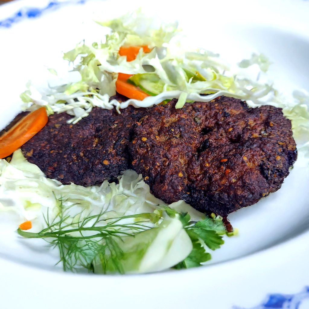 Chapli Kebab is a spicy, flavorful minced meat patty from the North-Western regions of the Indian subcontinent, known for its crispy edges, juicy texture, and bold spices. Perfect as an appetizer, snack, or a hearty main dish during festive occasions like Ramadan.
