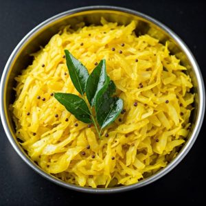 Kerala style cabbage thoran with grated coconut and spices in a bowl