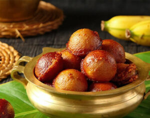 Traditional Kerala Unniyappam sweet fritters made with rice, banana, and jaggery.